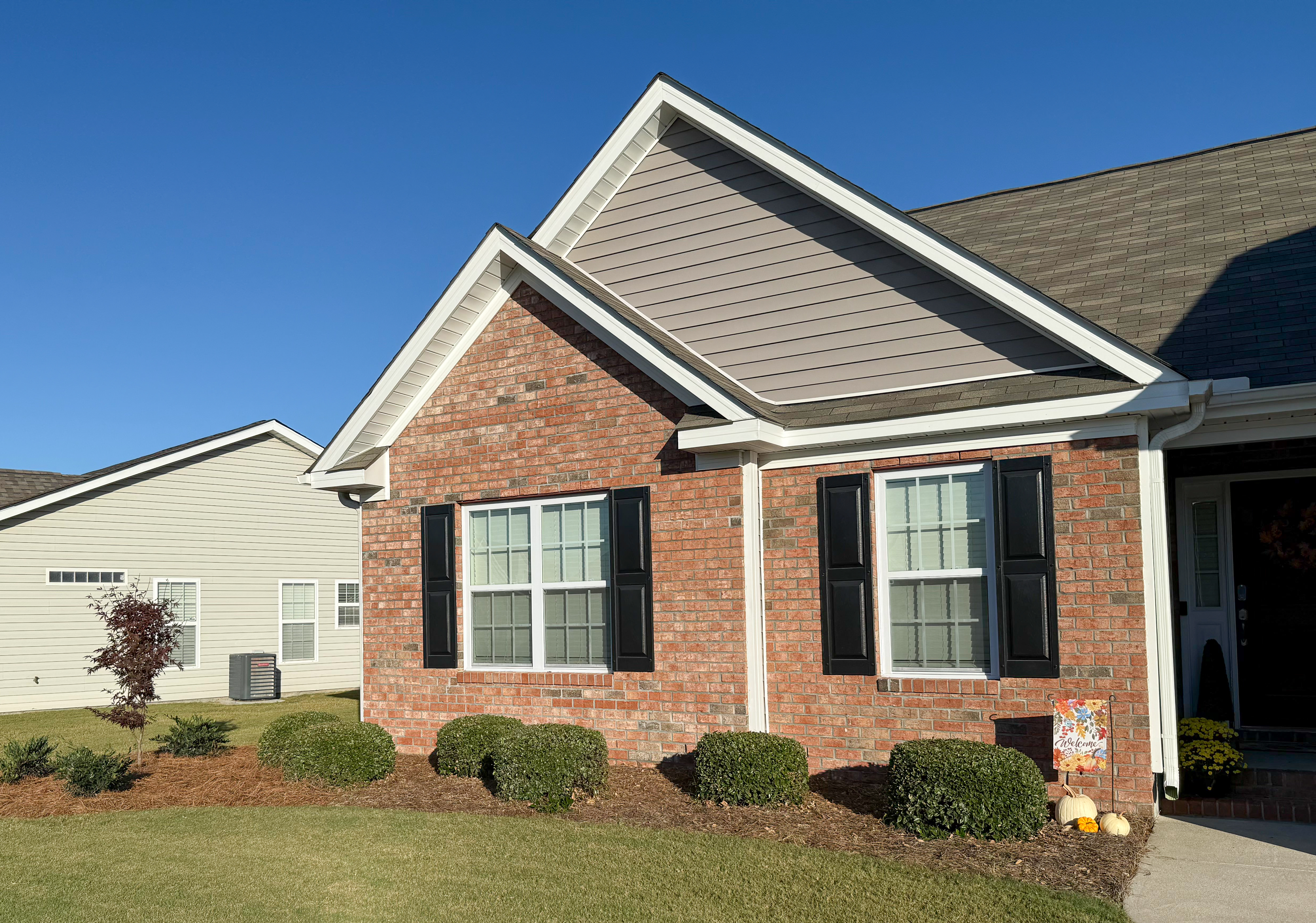 Brick home — front corner elevation.