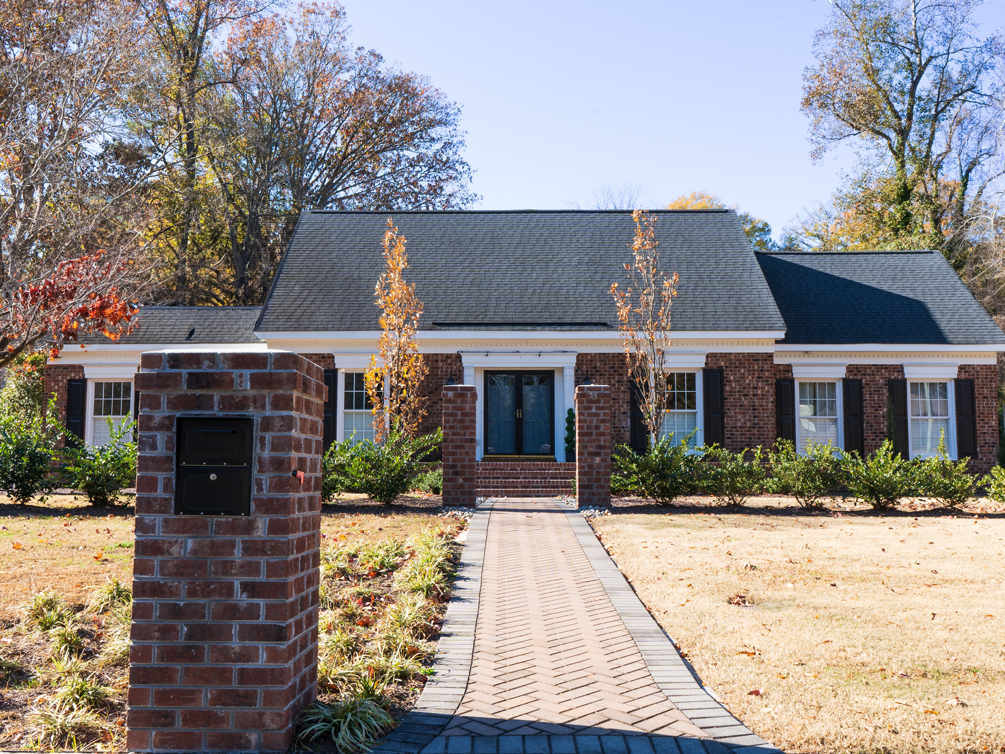 Southern brick home — front elevation with lighted entry columns.