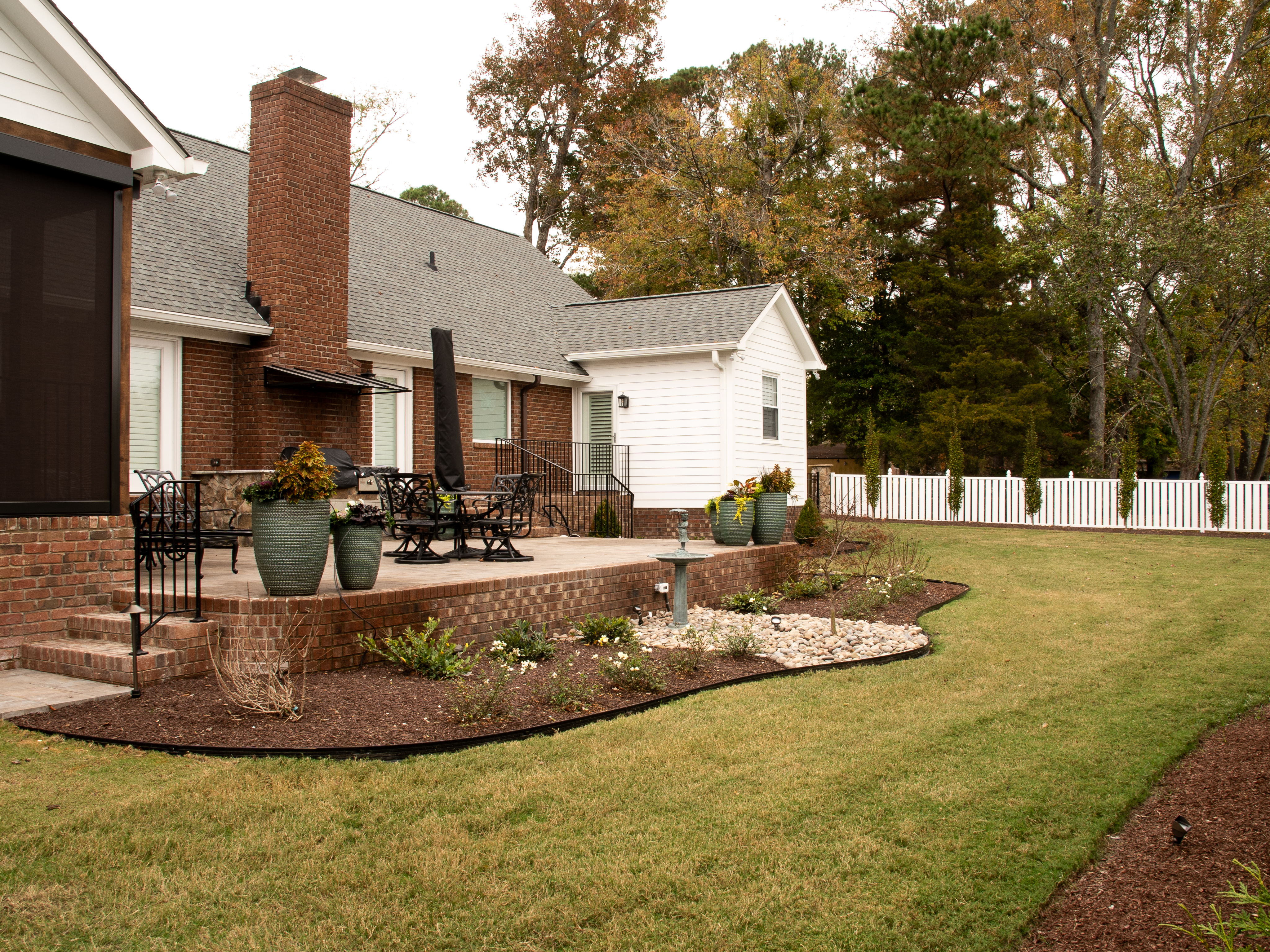 Stepped stone terrace with low seating wall.