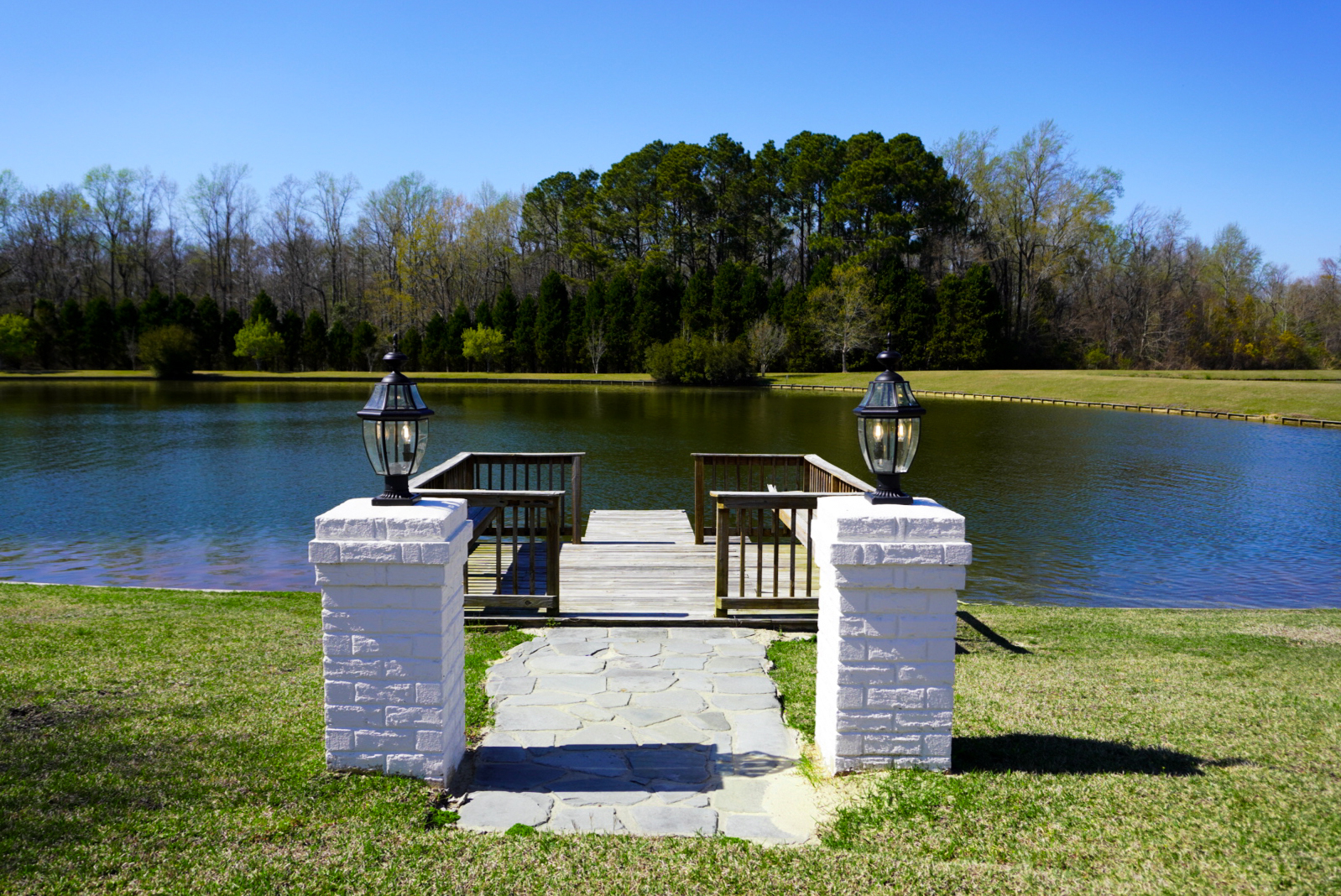 Pond dock — stone pillars front view.