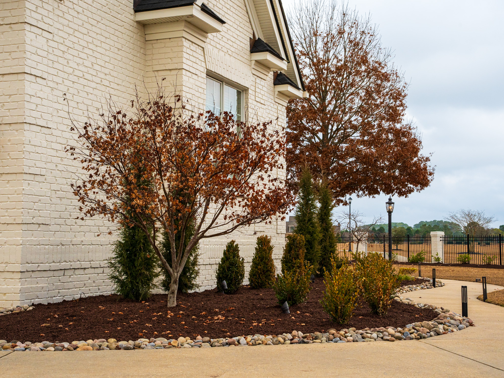 Water feature integrated with stone hardscape.